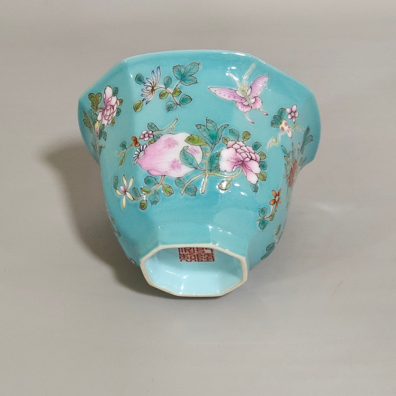 Qing Dynasty Qianlong turquoise green branched flowers and three more butterflies octagonal cup
