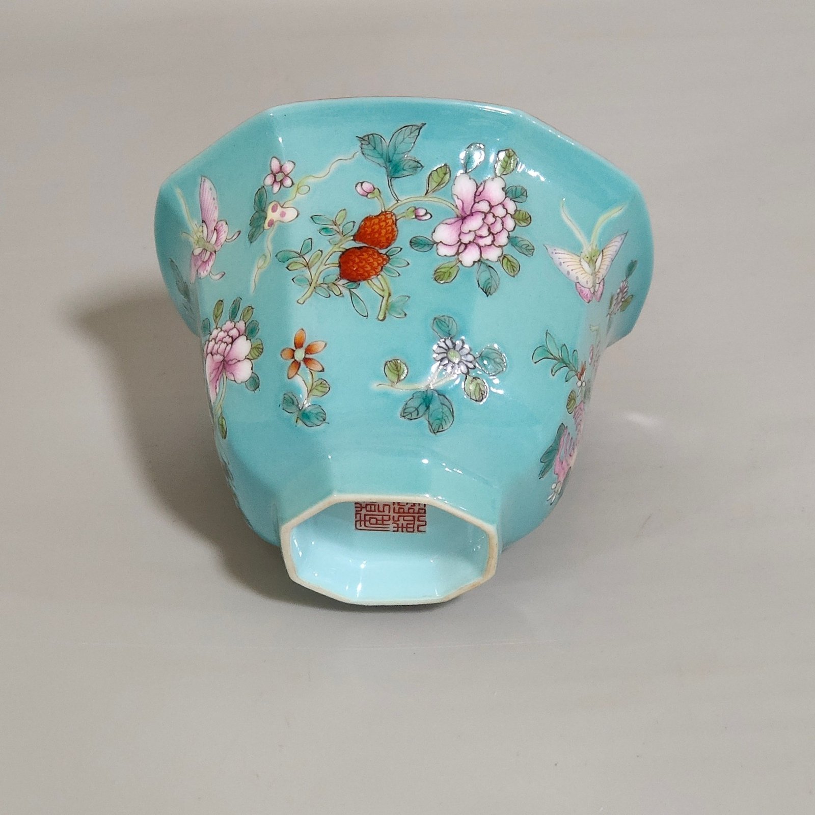 Qing Dynasty Qianlong turquoise green branched flowers and three more butterflies octagonal cup