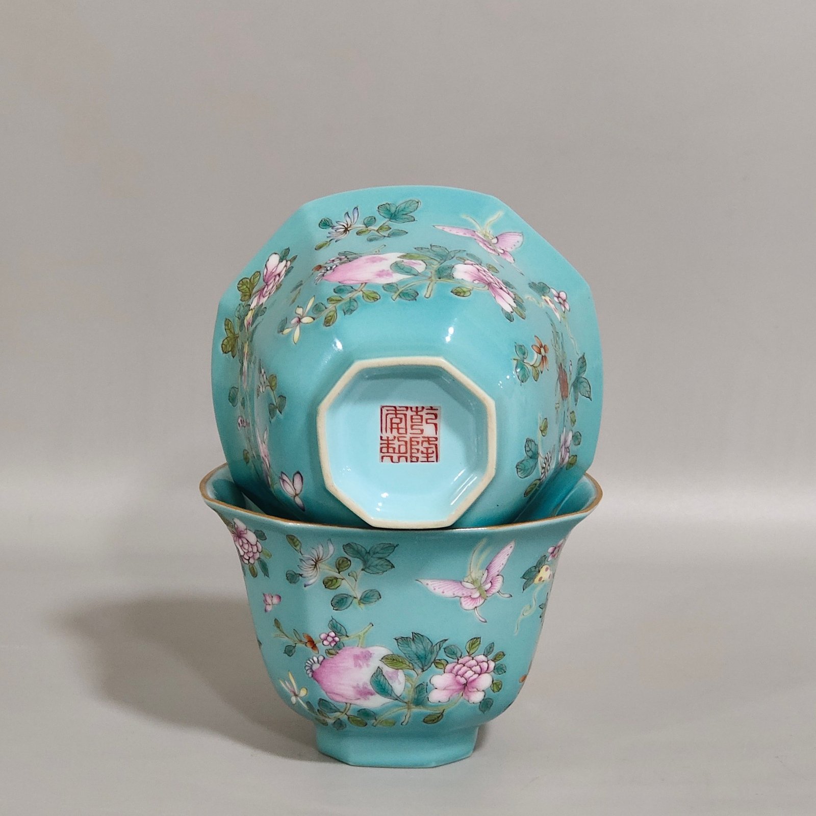 Qing Dynasty Qianlong turquoise green branched flowers and three more butterflies octagonal cup