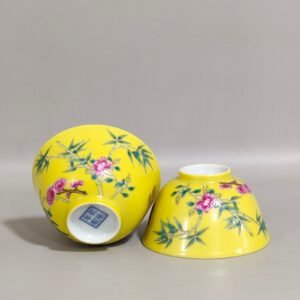 Qing Dynasty Qianlong lemon yellow glaze flower-inscribed cup