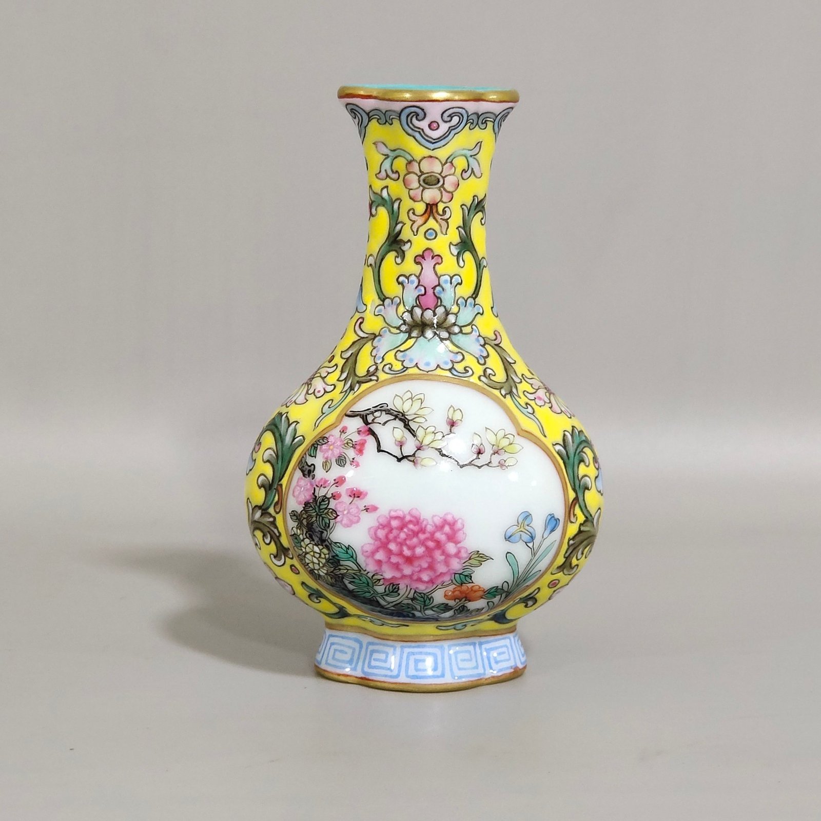 Qing Dynasty Qianlong Yangcai yellow ground windowed small begonia-shaped vase