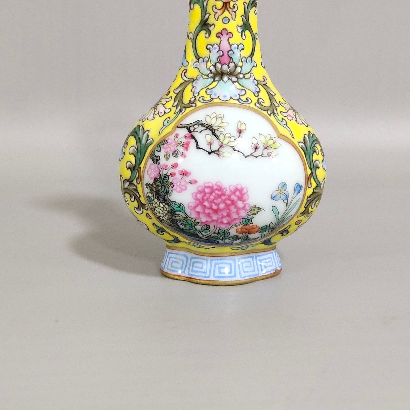 Qing Dynasty Qianlong Yangcai yellow ground windowed small begonia-shaped vase