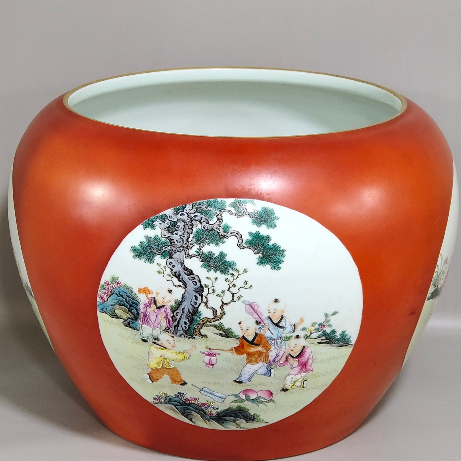 Qing Dynasty Qianlong Coral red apple vat with window showing baby playing