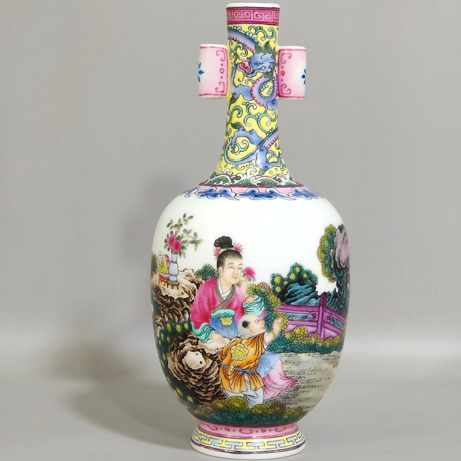 Qing Dynasty Qianlong enamel double-eared vase with a picture of a lady with a belt