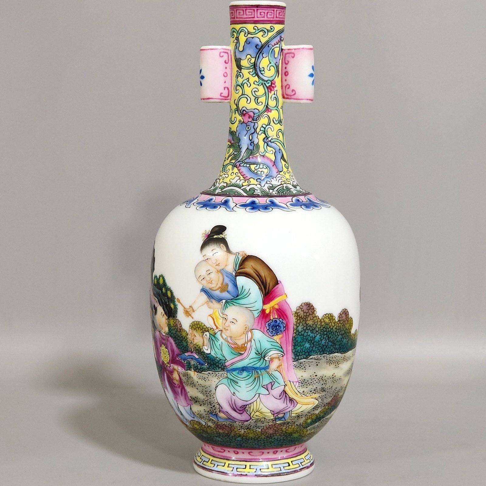 Qing Dynasty Qianlong enamel double-eared vase with a picture of a lady with a belt