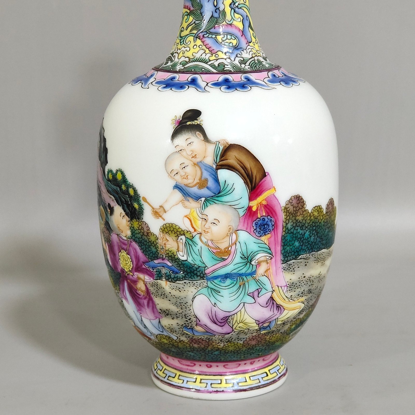 Qing Dynasty Qianlong enamel double-eared vase with a picture of a lady with a belt