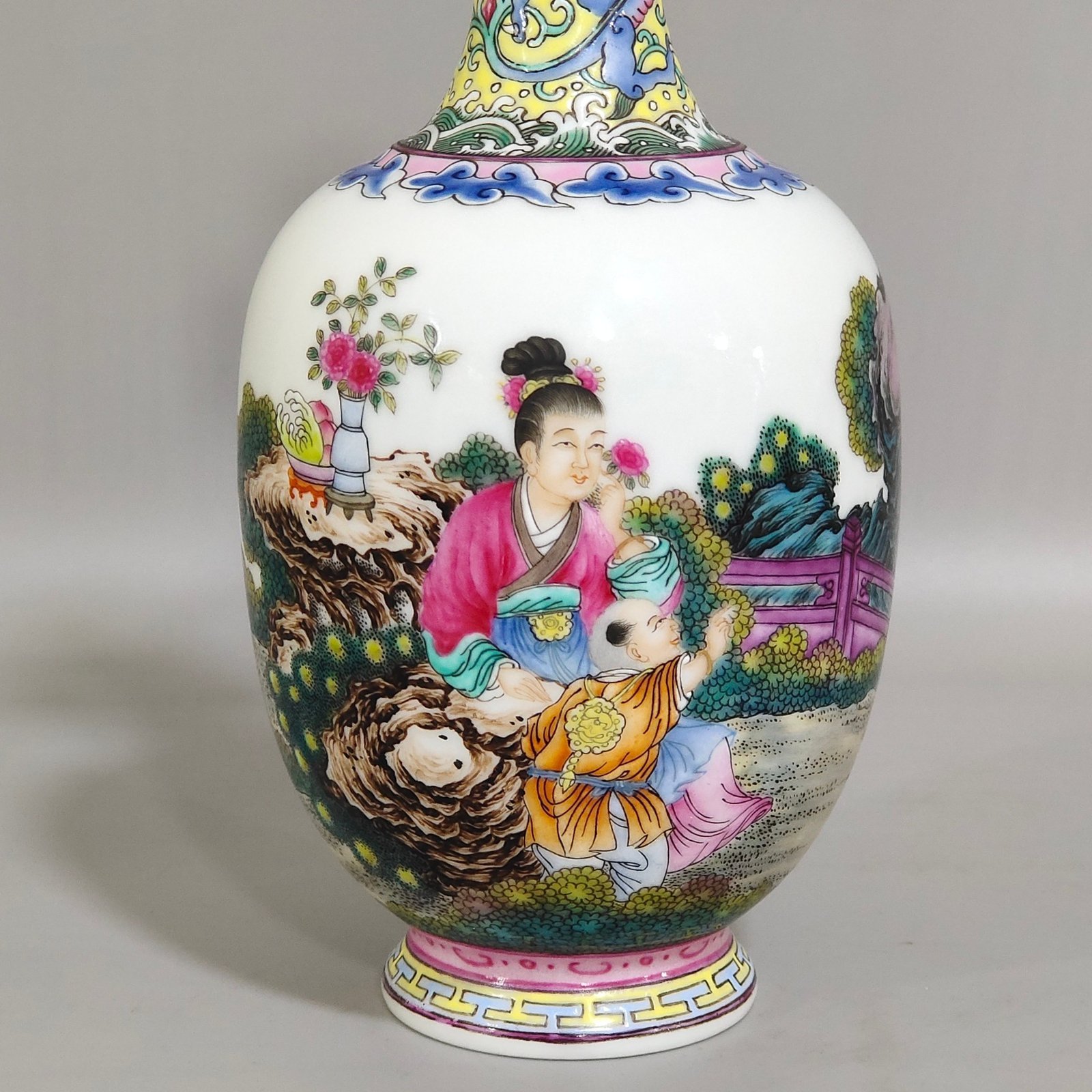 Qing Dynasty Qianlong enamel double-eared vase with a picture of a lady with a belt
