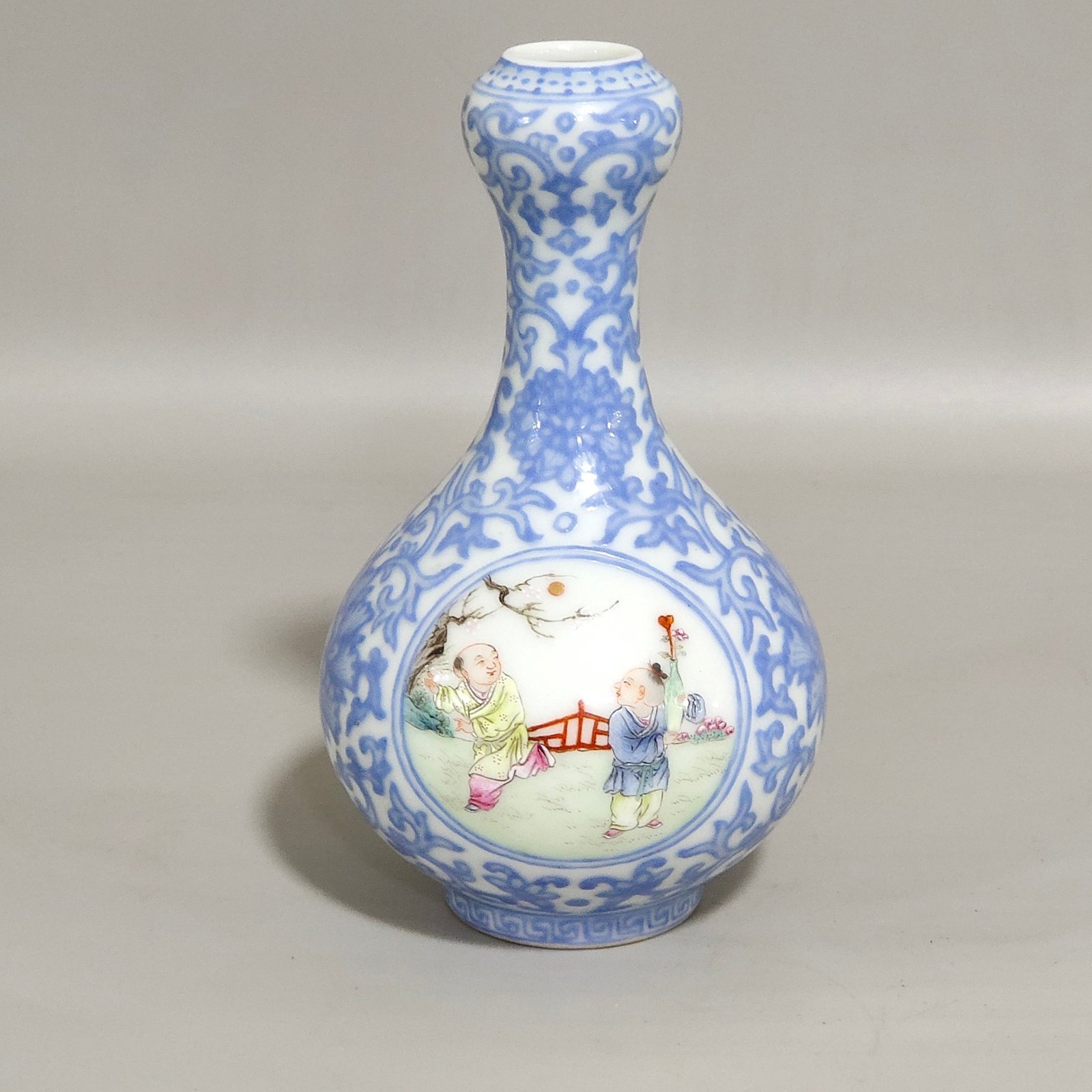 Qing Dynasty Qianlong enamel emerald blue windowed boy’s vase