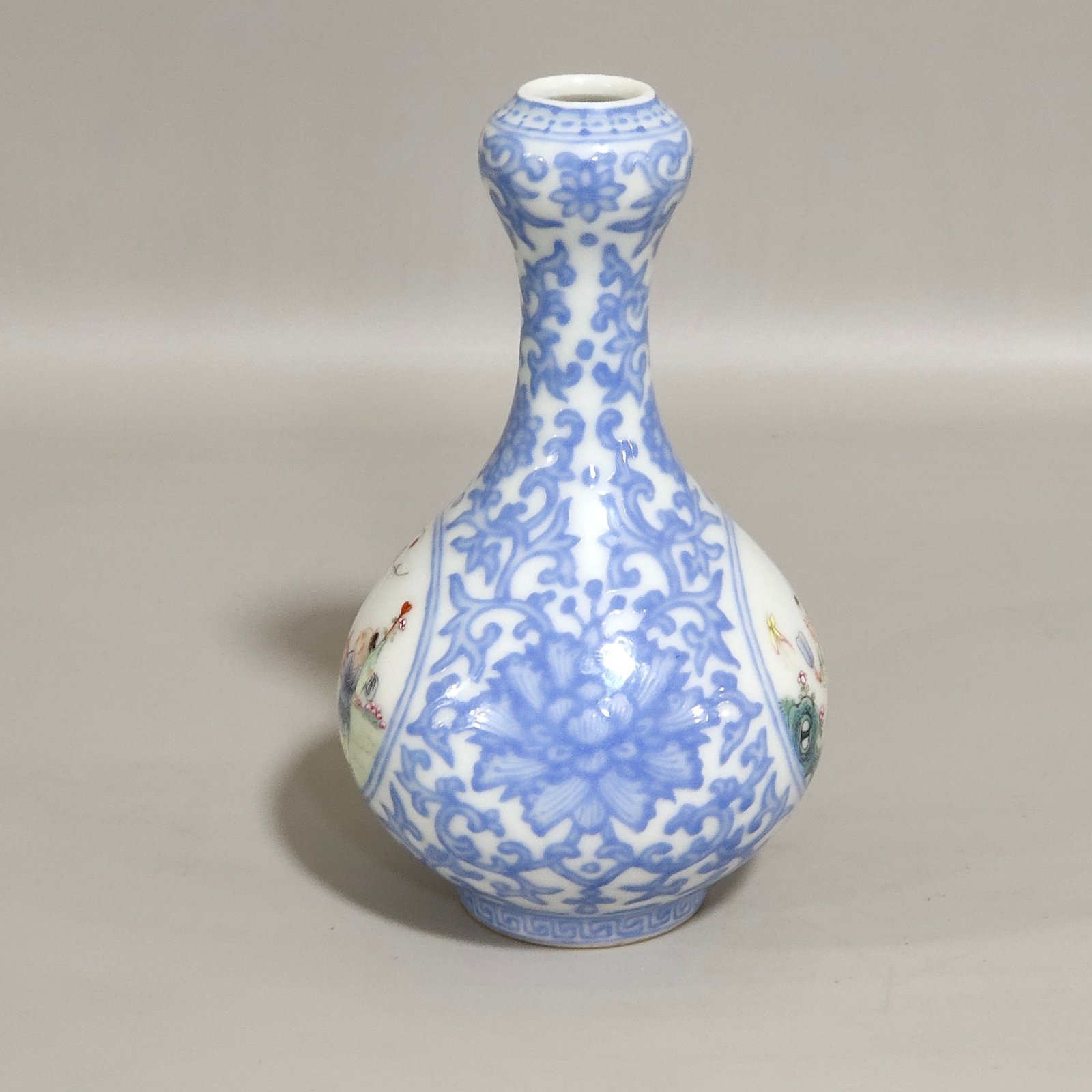Qing Dynasty Qianlong enamel emerald blue windowed boy’s vase