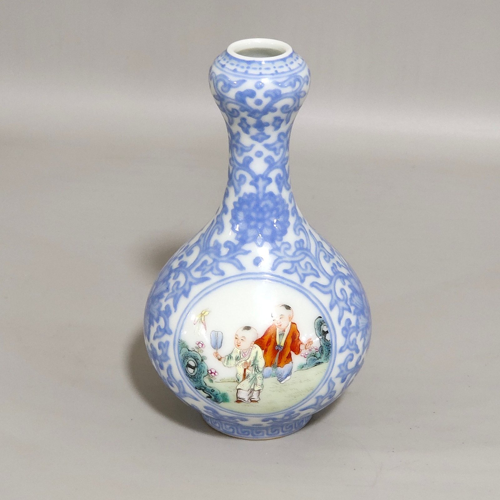 Qing Dynasty Qianlong enamel emerald blue windowed boy’s vase