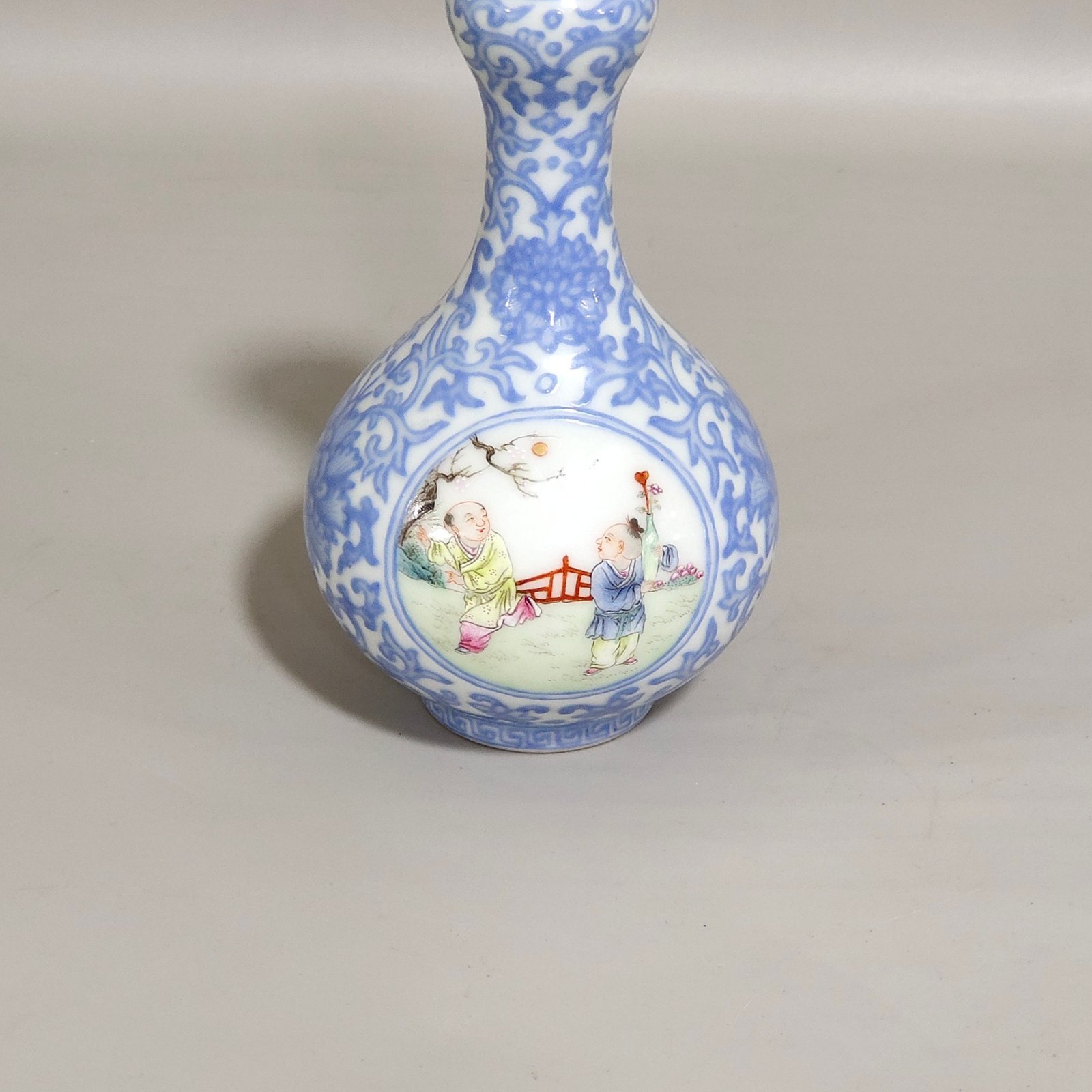 Qing Dynasty Qianlong enamel emerald blue windowed boy’s vase