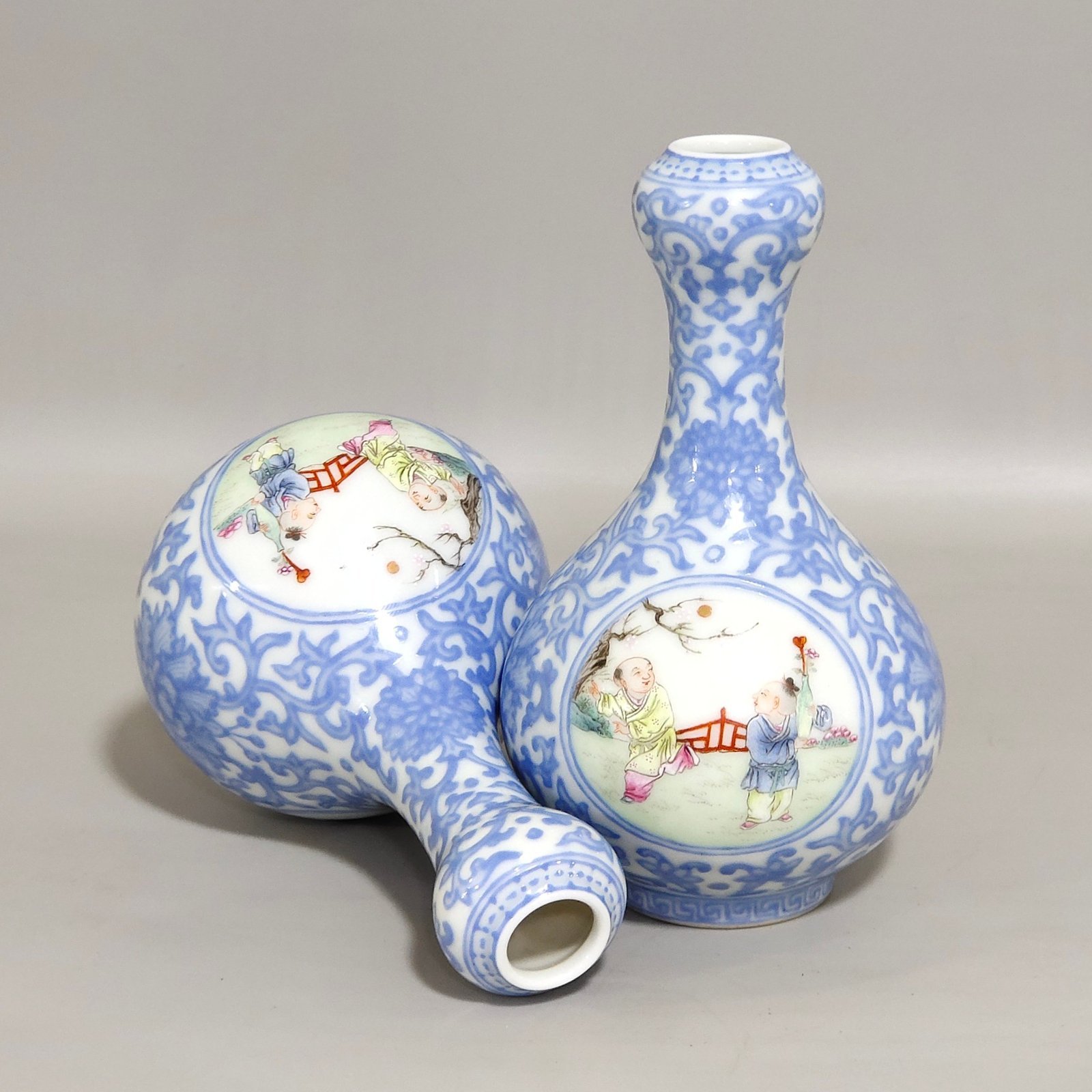 Qing Dynasty Qianlong enamel emerald blue windowed boy’s vase