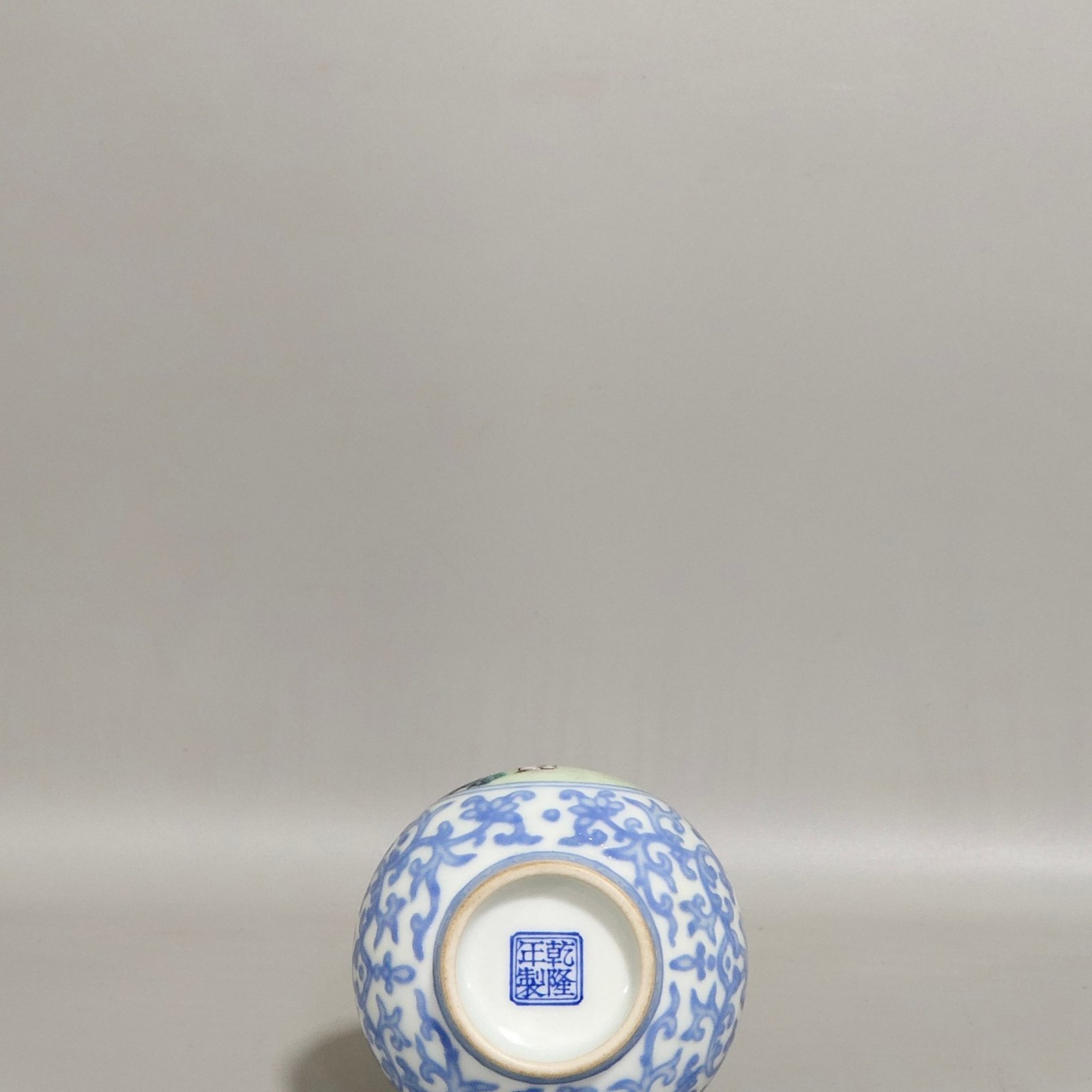 Qing Dynasty Qianlong enamel emerald blue windowed boy’s vase