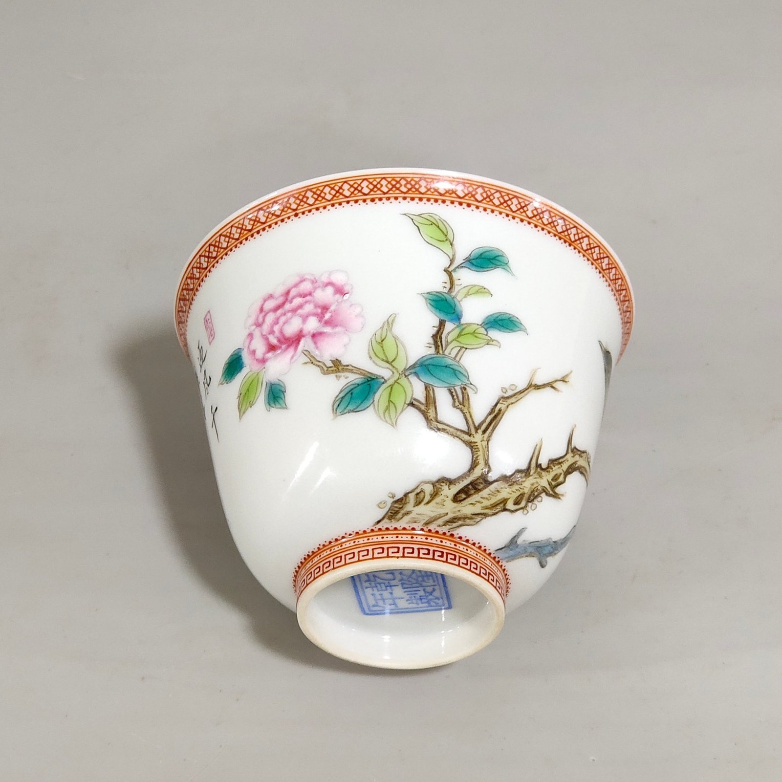 Qing Dynasty Qianlong enamel cup with flowers and birds inscribed with poems