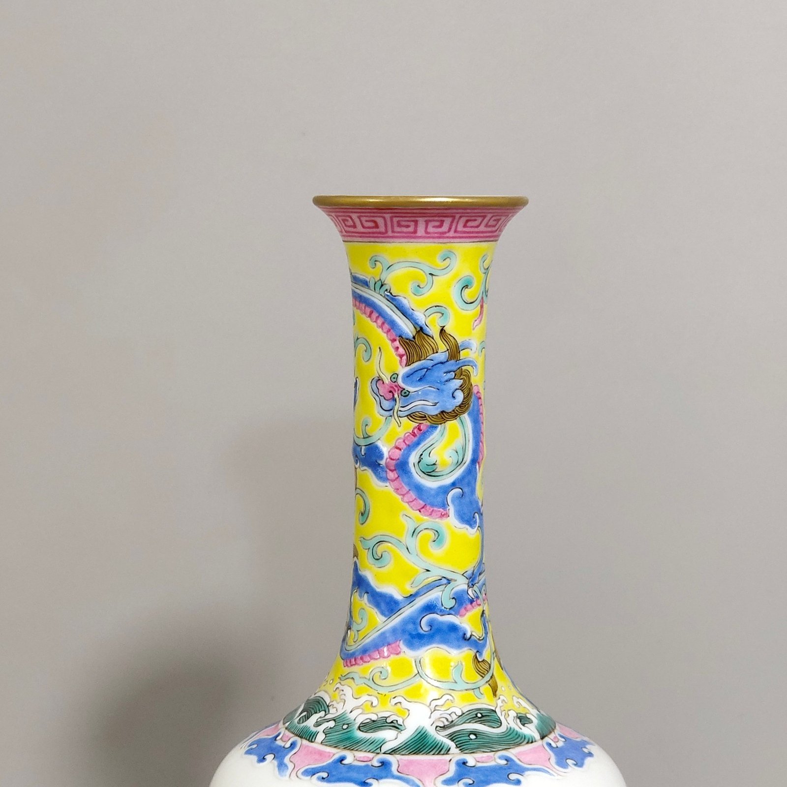 Qing Dynasty Qianlong enamel red dragon piercing flowers Western figure flask