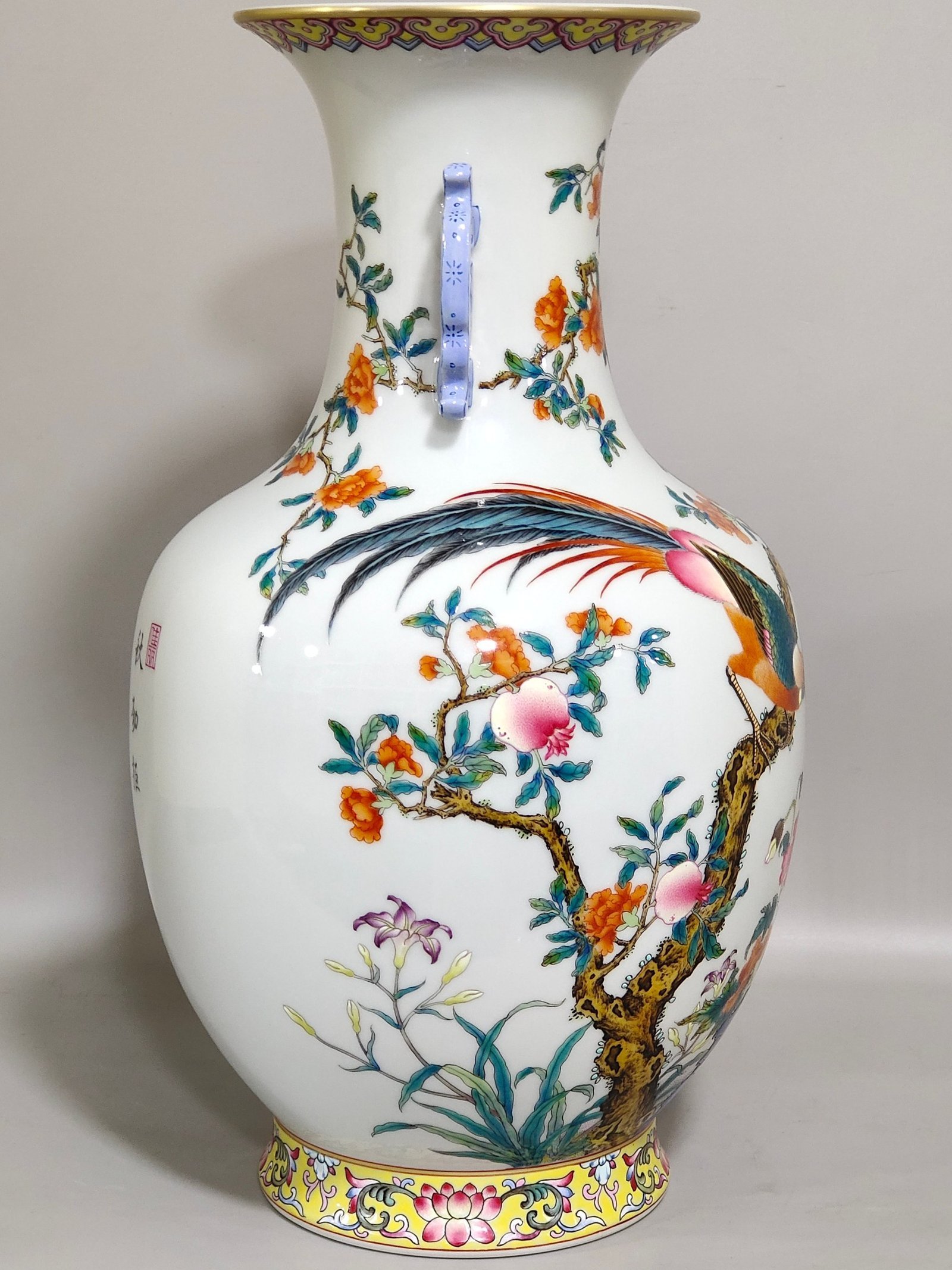Qing Dynasty Qianlong pomegranate flower and golden pheasant double eared poem vase