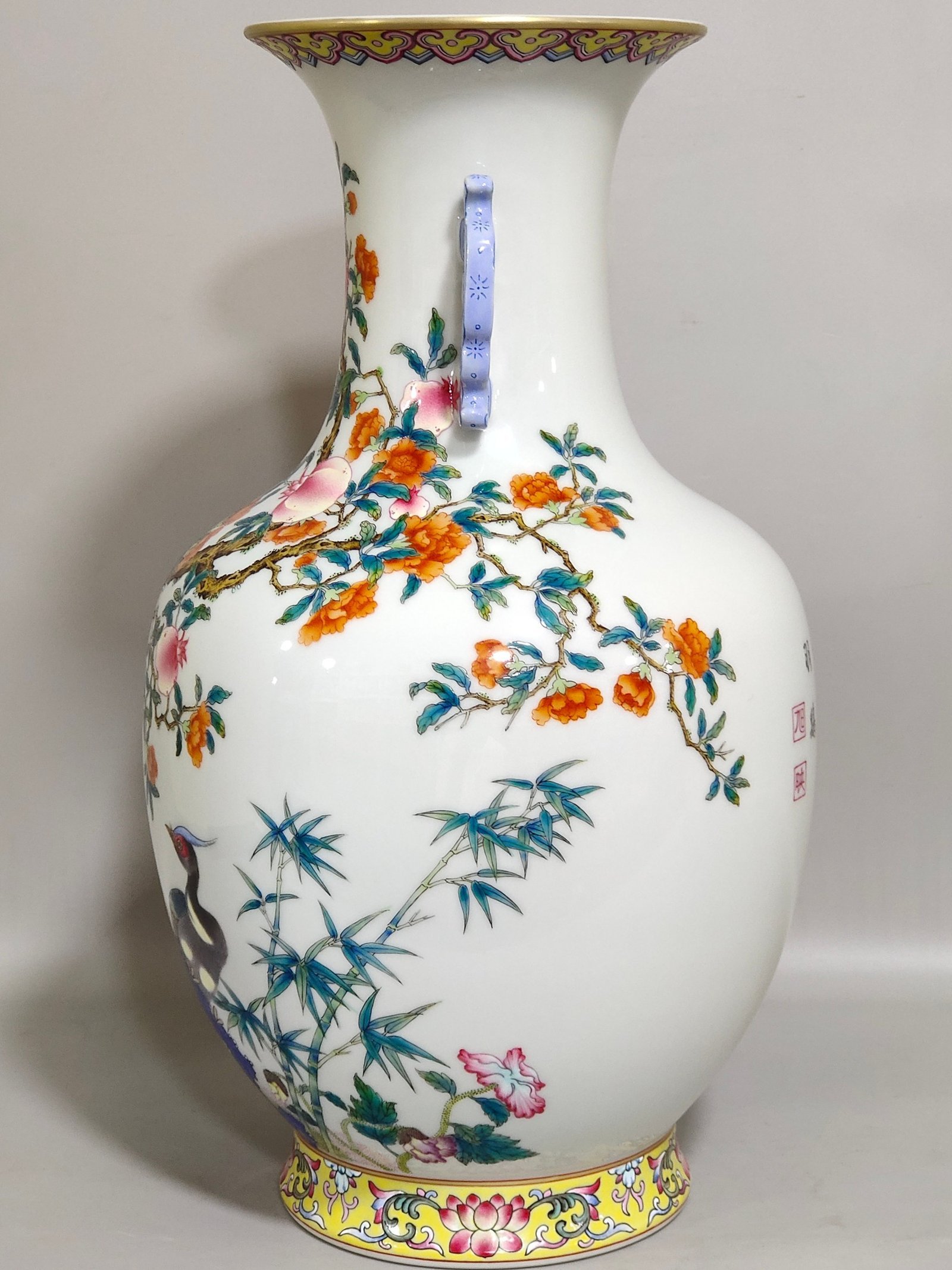 Qing Dynasty Qianlong pomegranate flower and golden pheasant double eared poem vase
