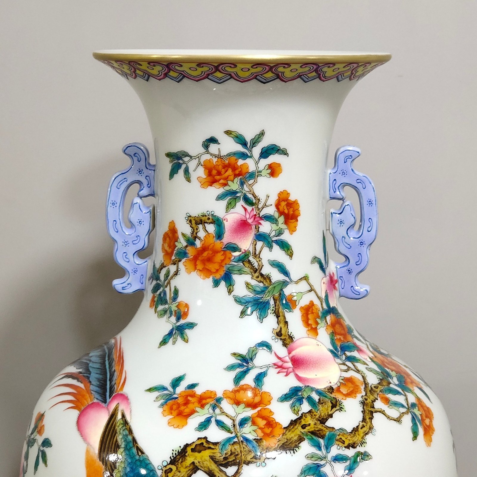 Qing Dynasty Qianlong pomegranate flower and golden pheasant double eared poem vase