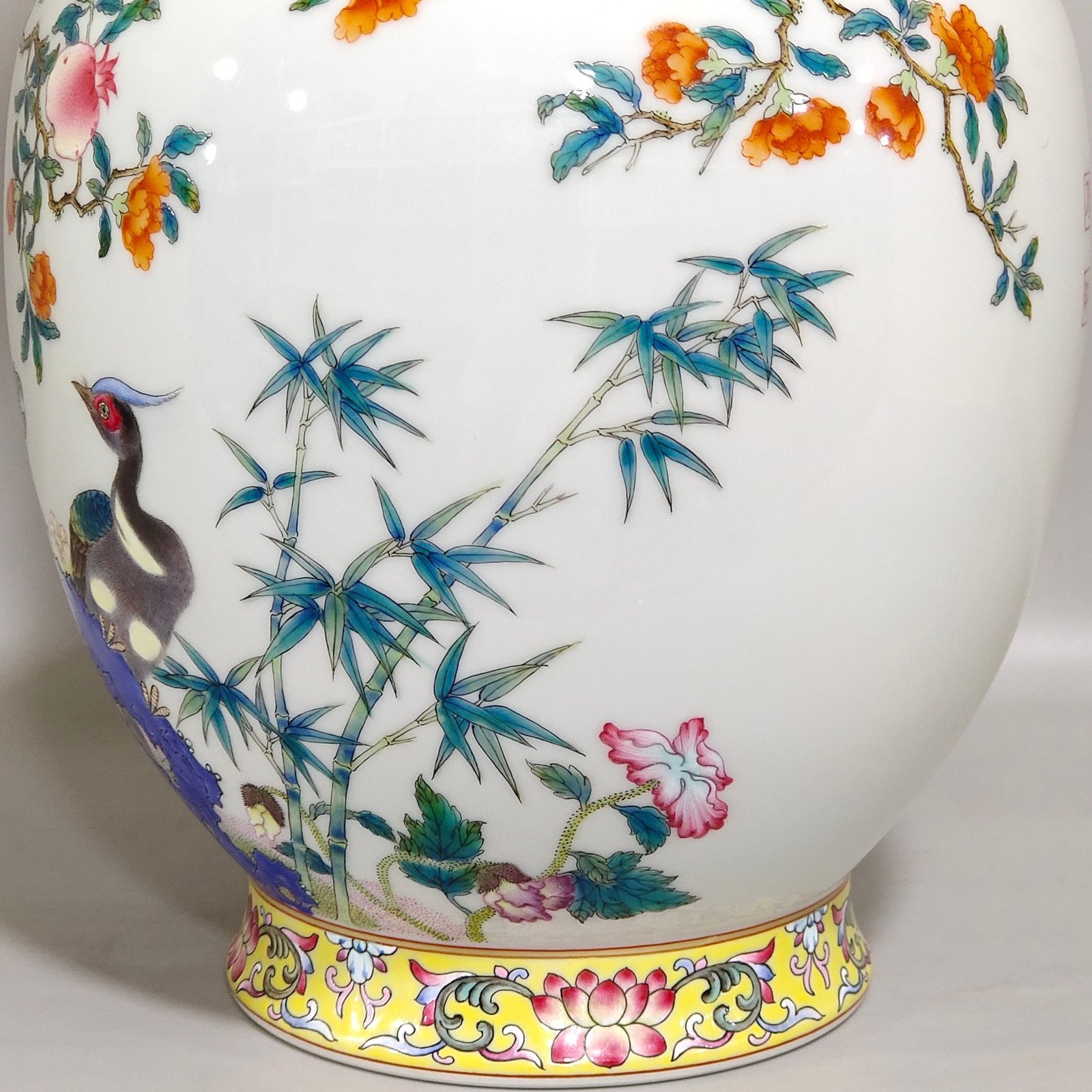 Qing Dynasty Qianlong pomegranate flower and golden pheasant double eared poem vase