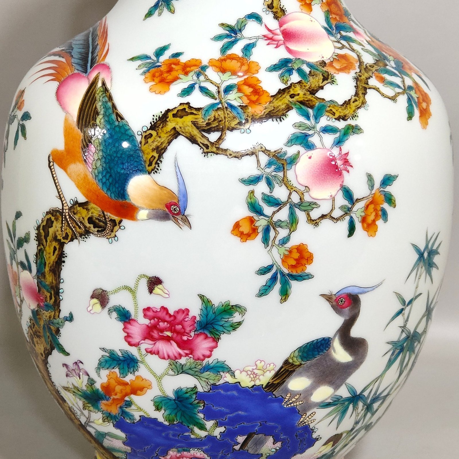 Qing Dynasty Qianlong pomegranate flower and golden pheasant double eared poem vase
