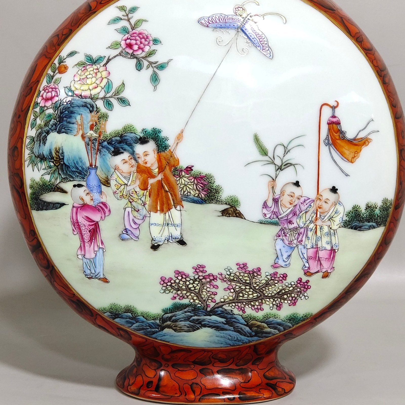 Qing Dynasty Qianlong stone patterned glazed window vase with baby playing and holding the moon