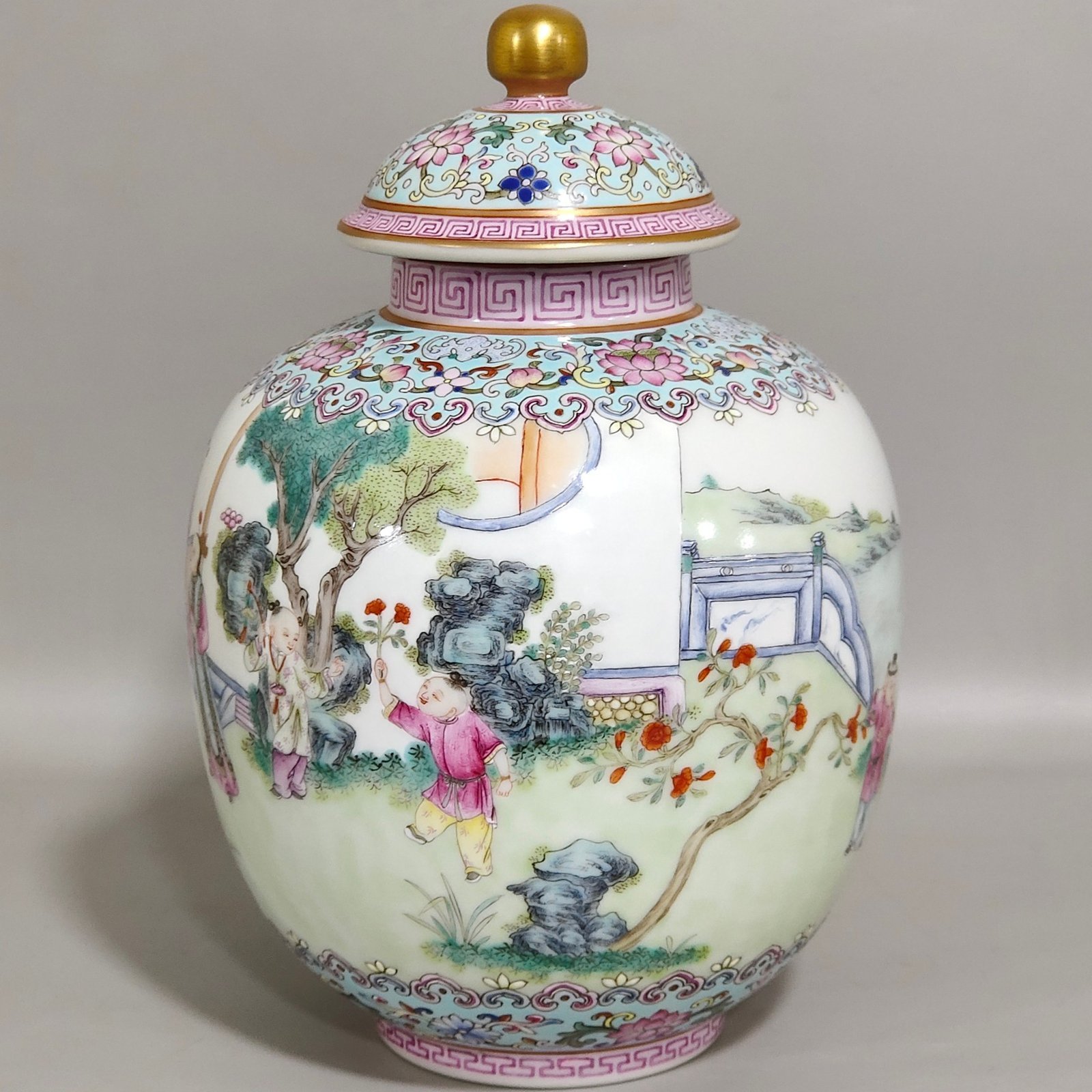 Qing Dynasty Qianlong tea can with baby playing beside green space