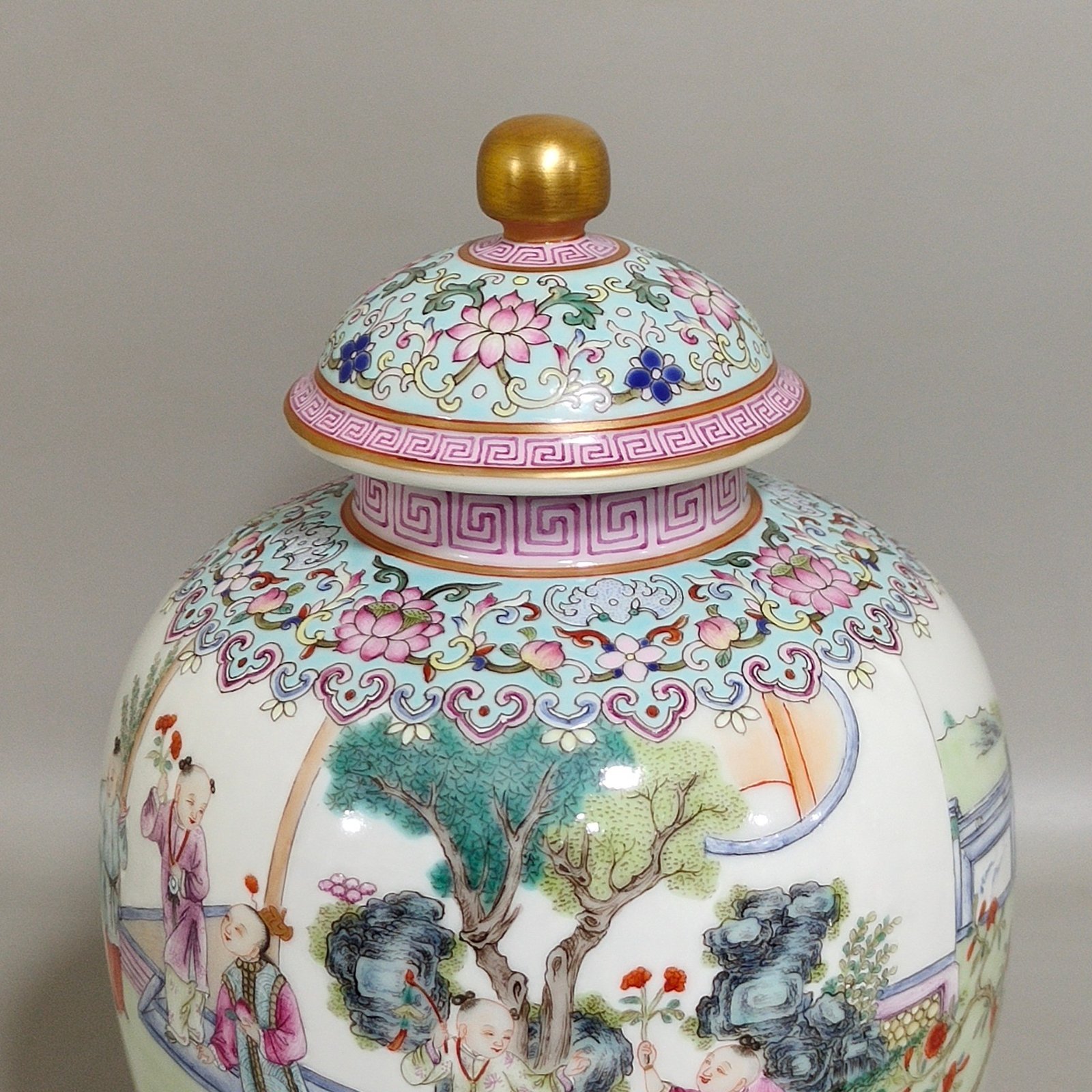 Qing Dynasty Qianlong tea can with baby playing beside green space