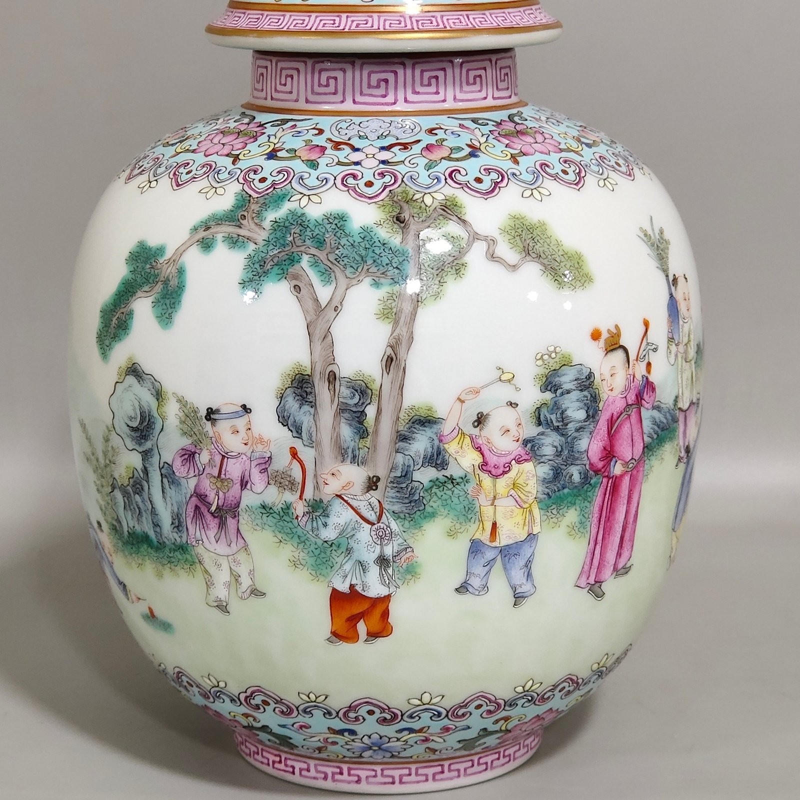 Qing Dynasty Qianlong tea can with baby playing beside green space
