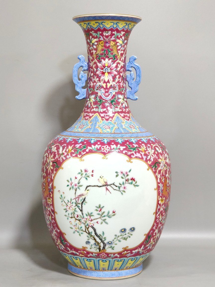 Qing Dynasty Qianlong rouge ground windowed flower and bird amphorae