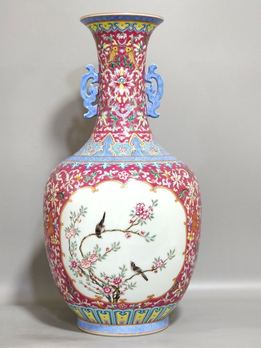 Qing Dynasty Qianlong rouge ground windowed flower and bird amphorae