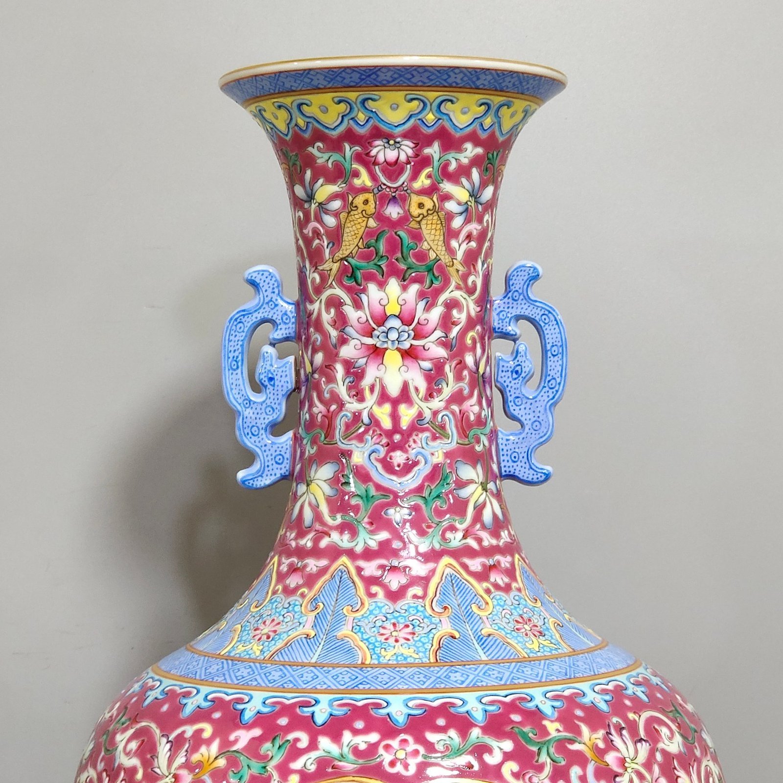 Qing Dynasty Qianlong rouge ground windowed flower and bird amphorae