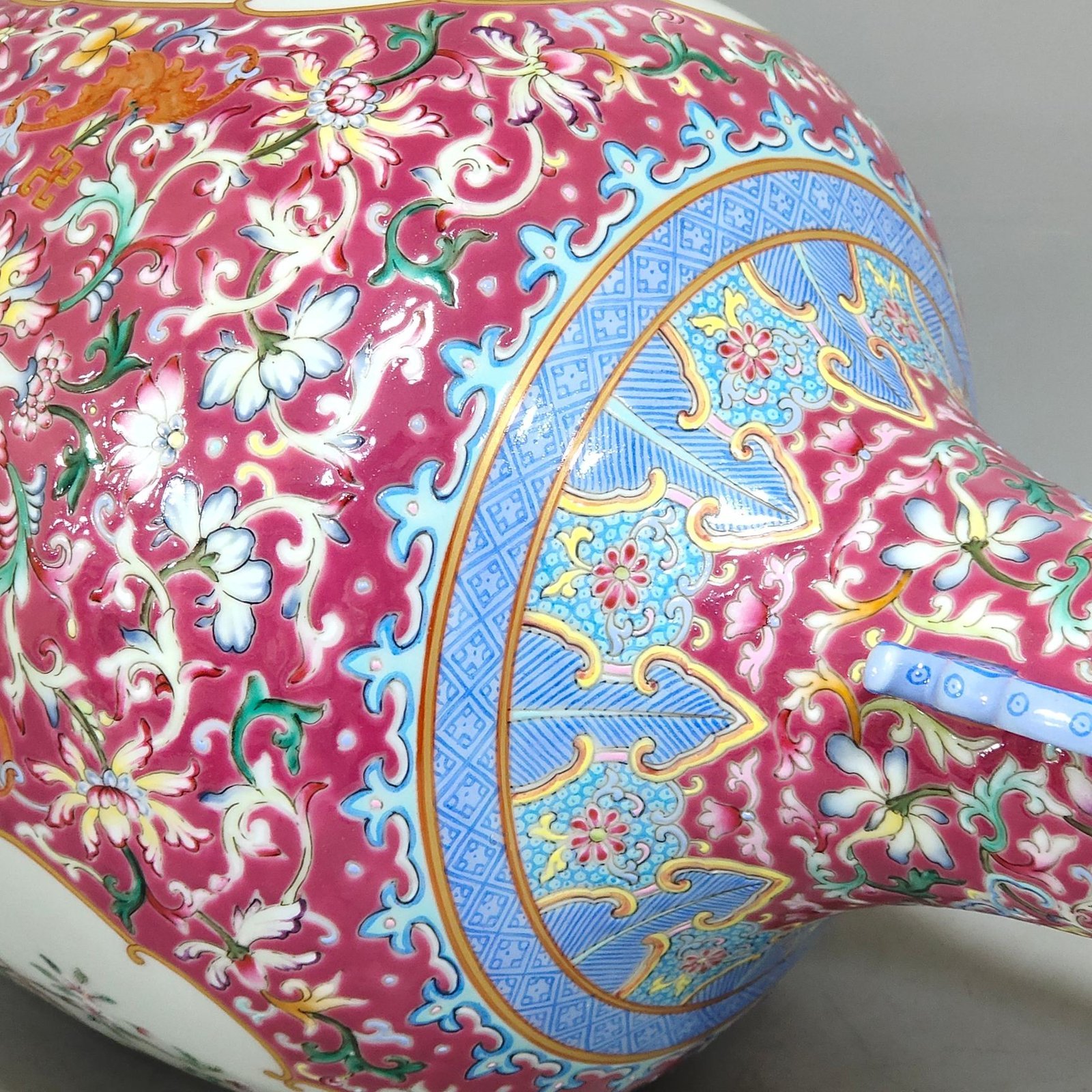 Qing Dynasty Qianlong rouge ground windowed flower and bird amphorae