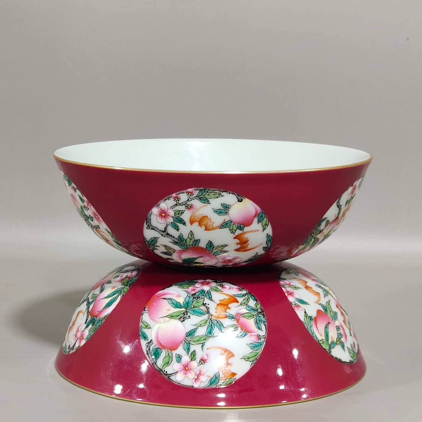 Qing Dynasty Qianlong rouge red windowed longevity peach nest foot bowl