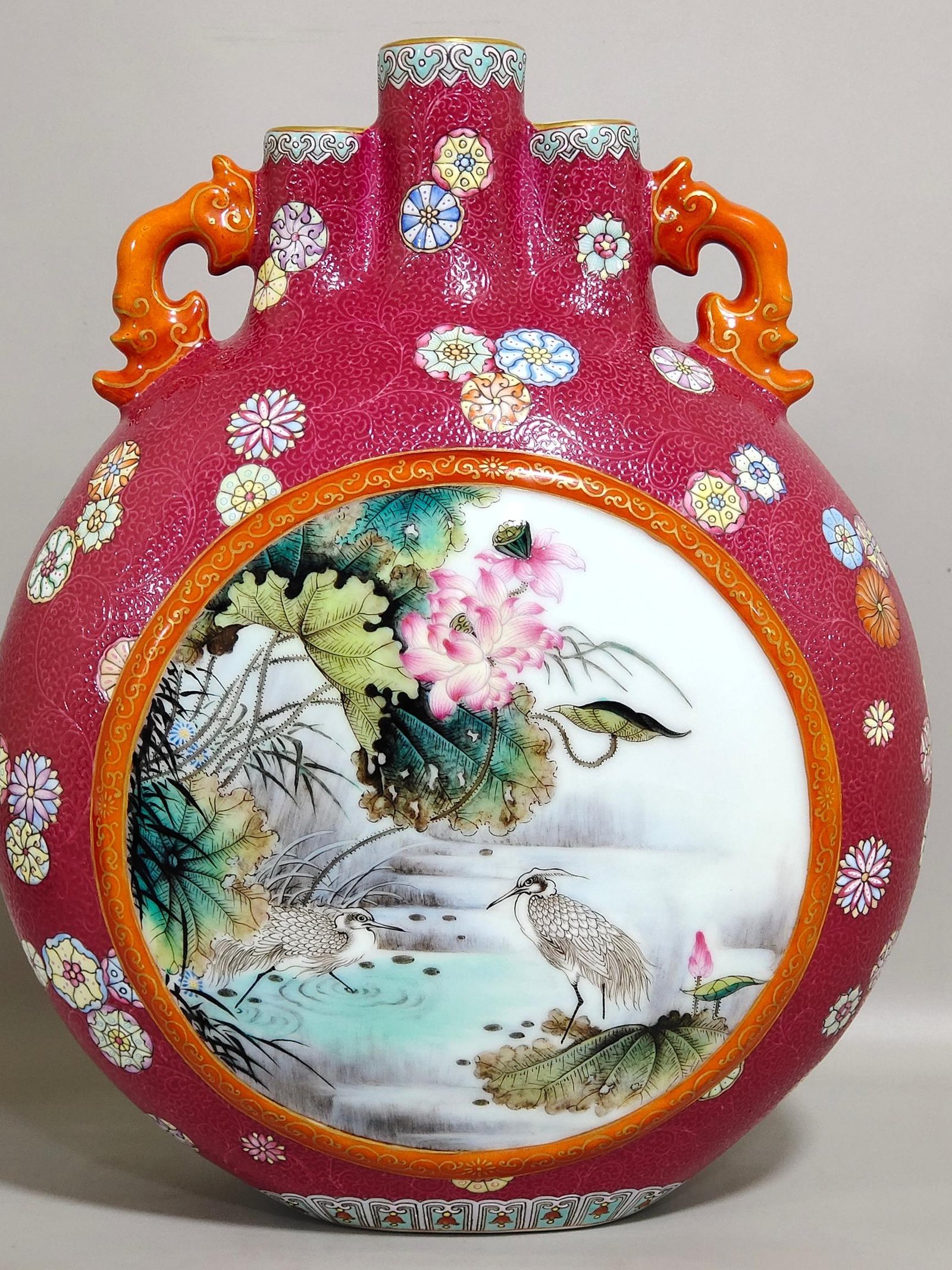Qing Dynasty Qianlong rouge red leather ball flower opening window with three tubes holding the moon vase