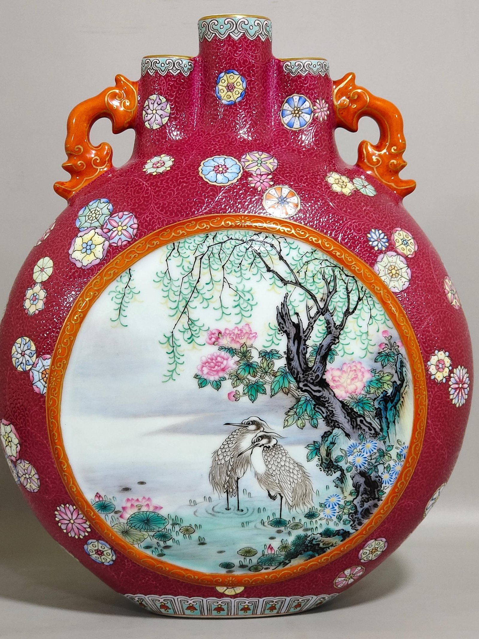 Qing Dynasty Qianlong rouge red leather ball flower opening window with three tubes holding the moon vase