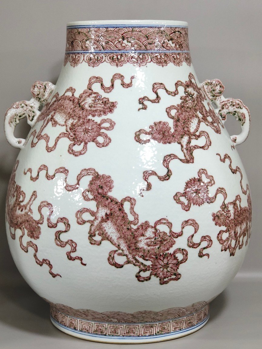 Qing Dynasty Qianlong underglaze red Buddha bucket statue