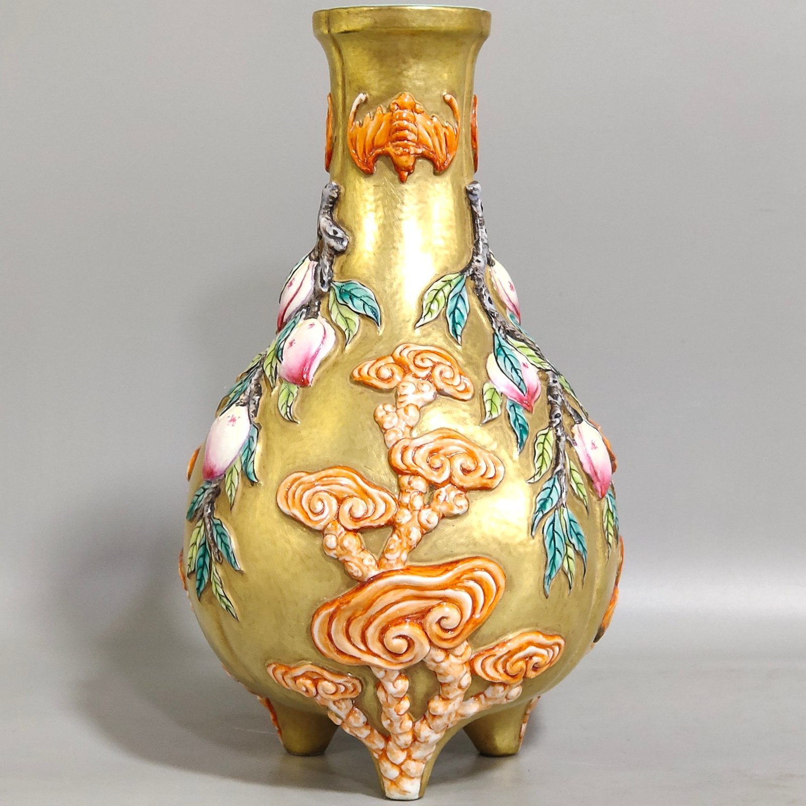 Qing Dynasty Qianlong gold relief three legged bottle of longevity peach and Ganoderma lucidum