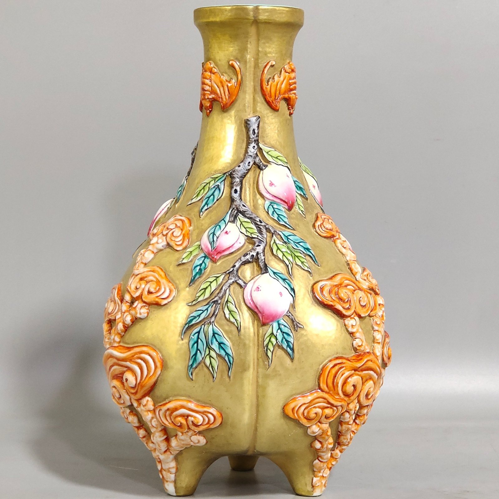 Qing Dynasty Qianlong gold relief three legged bottle of longevity peach and Ganoderma lucidum