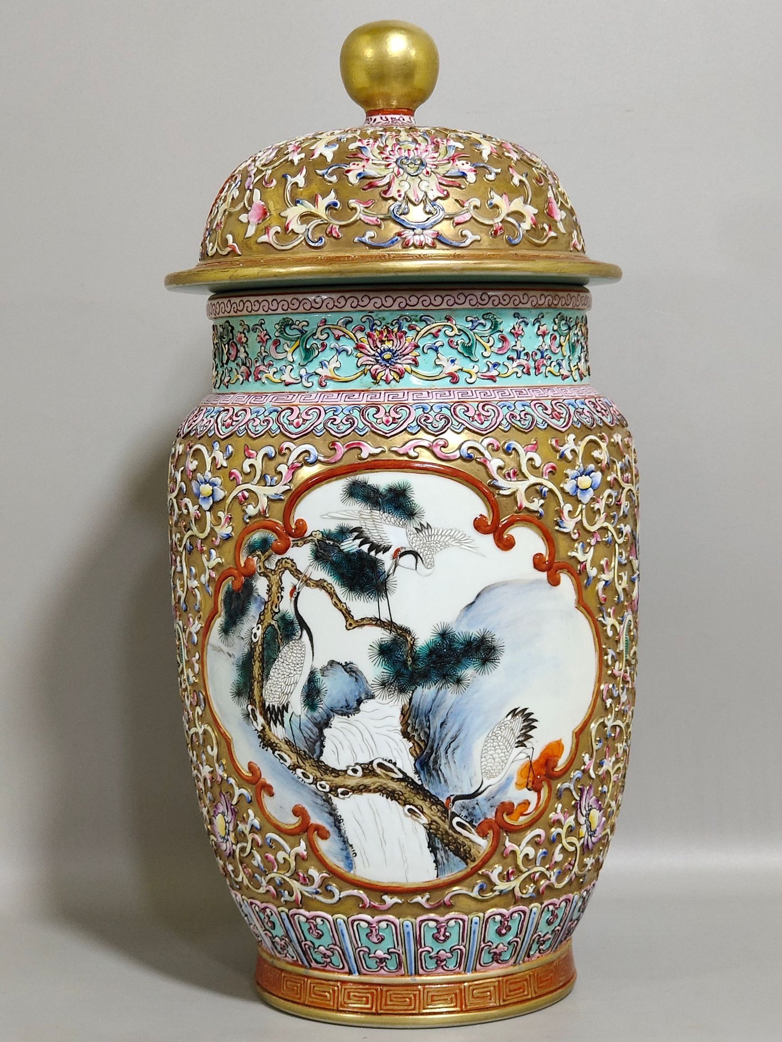 Qing Dynasty Qianlong gold plated relief with window pines and cranes to promote longevity and covered jar