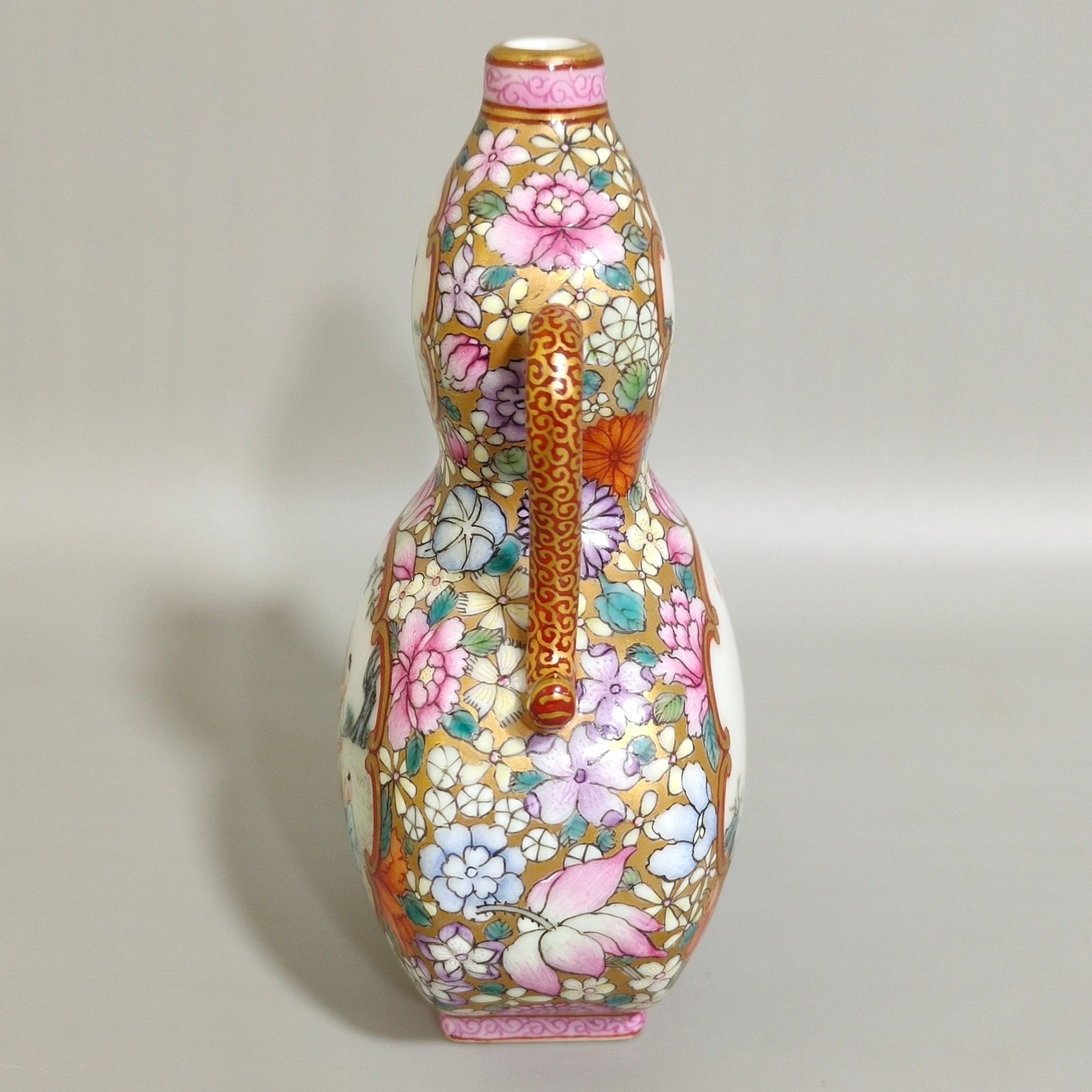 Qing Dynasty Qianlong Golden Ground Hundred Flowers Open Window Boy’s Flat Gourd Vase
