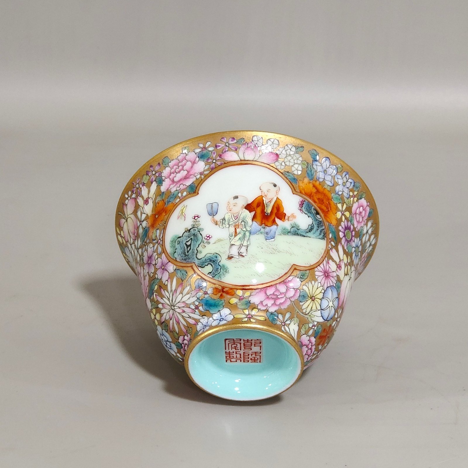 Qing Dynasty Qianlong a gold bottomed boy’s bowl with a hundred flowers and a window