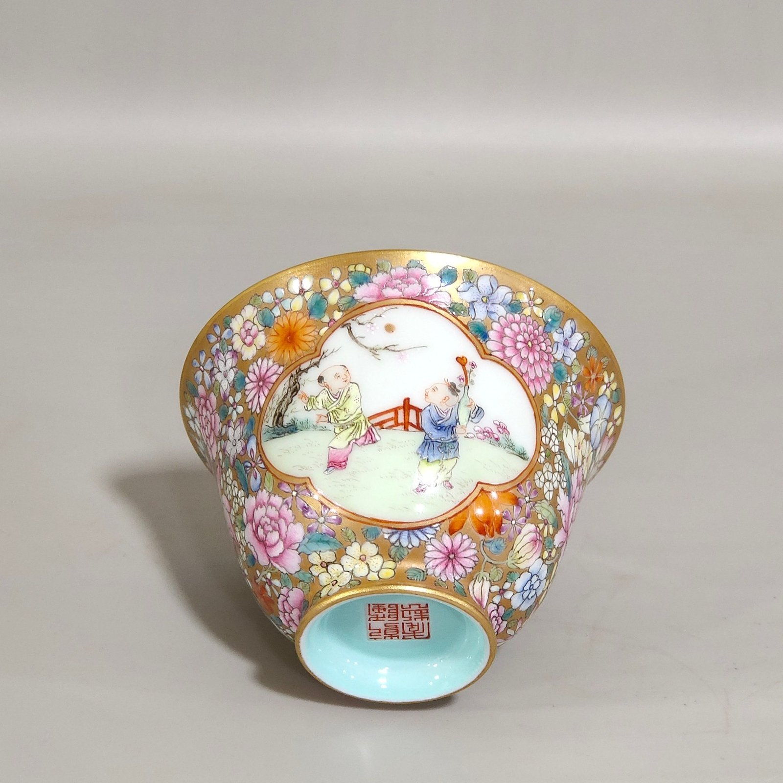 Qing Dynasty Qianlong a gold bottomed boy’s bowl with a hundred flowers and a window