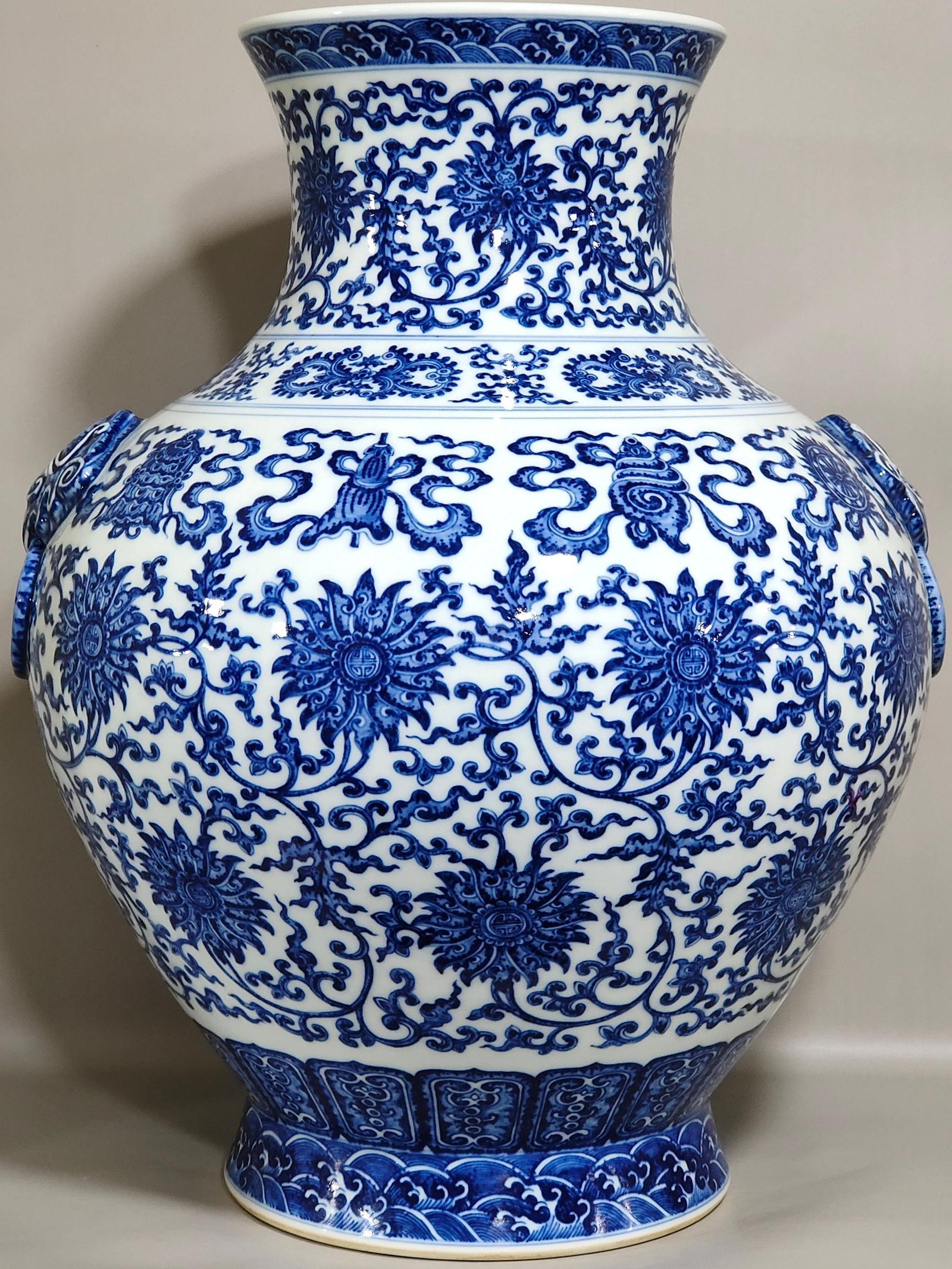 Qing Dynasty Qianlong blue and white intertwined branches with eight treasure vase