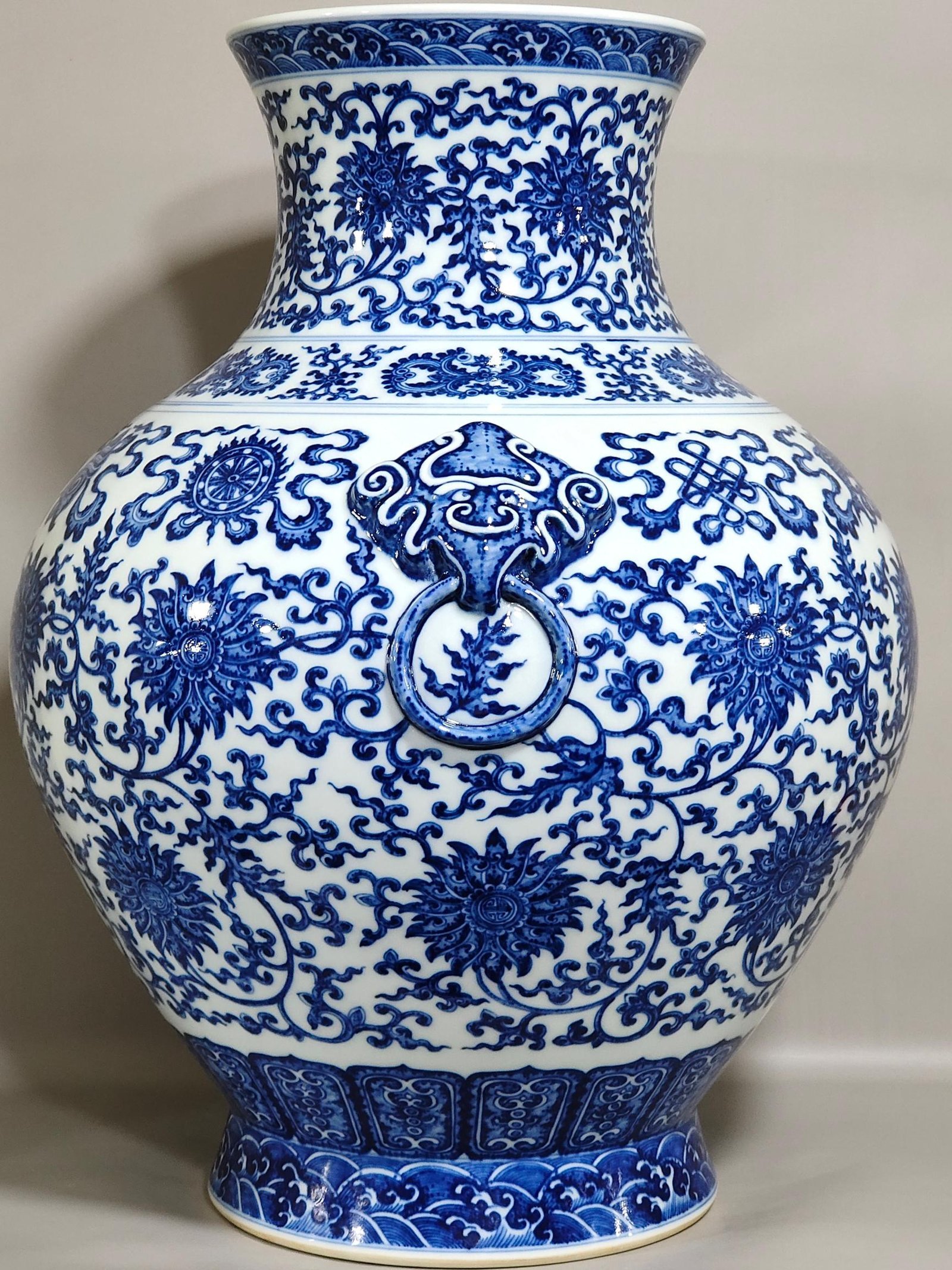 Qing Dynasty Qianlong blue and white intertwined branches with eight treasure vase