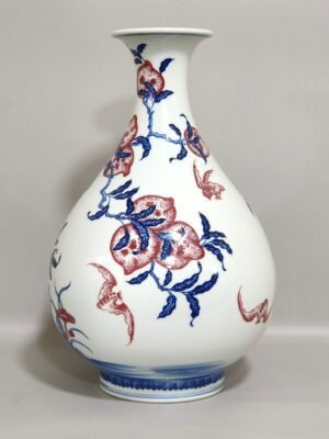 Qing Dynasty Qianlong blue and white underglaze red Nine Peach spring vase