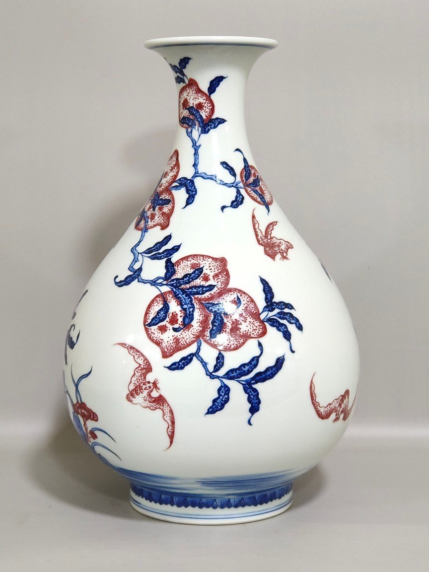 Qing Dynasty Qianlong blue and white underglaze red Nine Peach spring vase