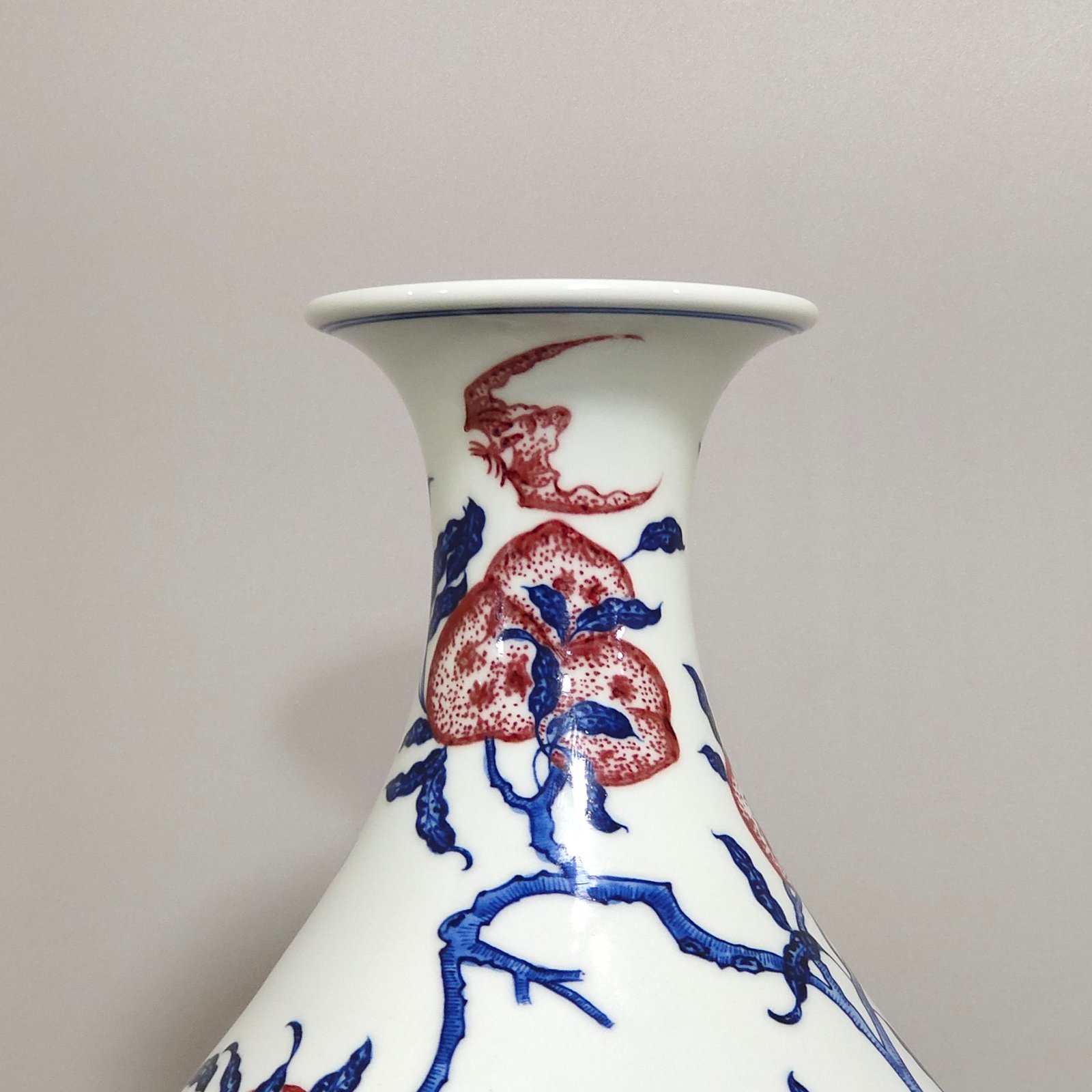 Qing Dynasty Qianlong blue and white underglaze red Nine Peach spring vase