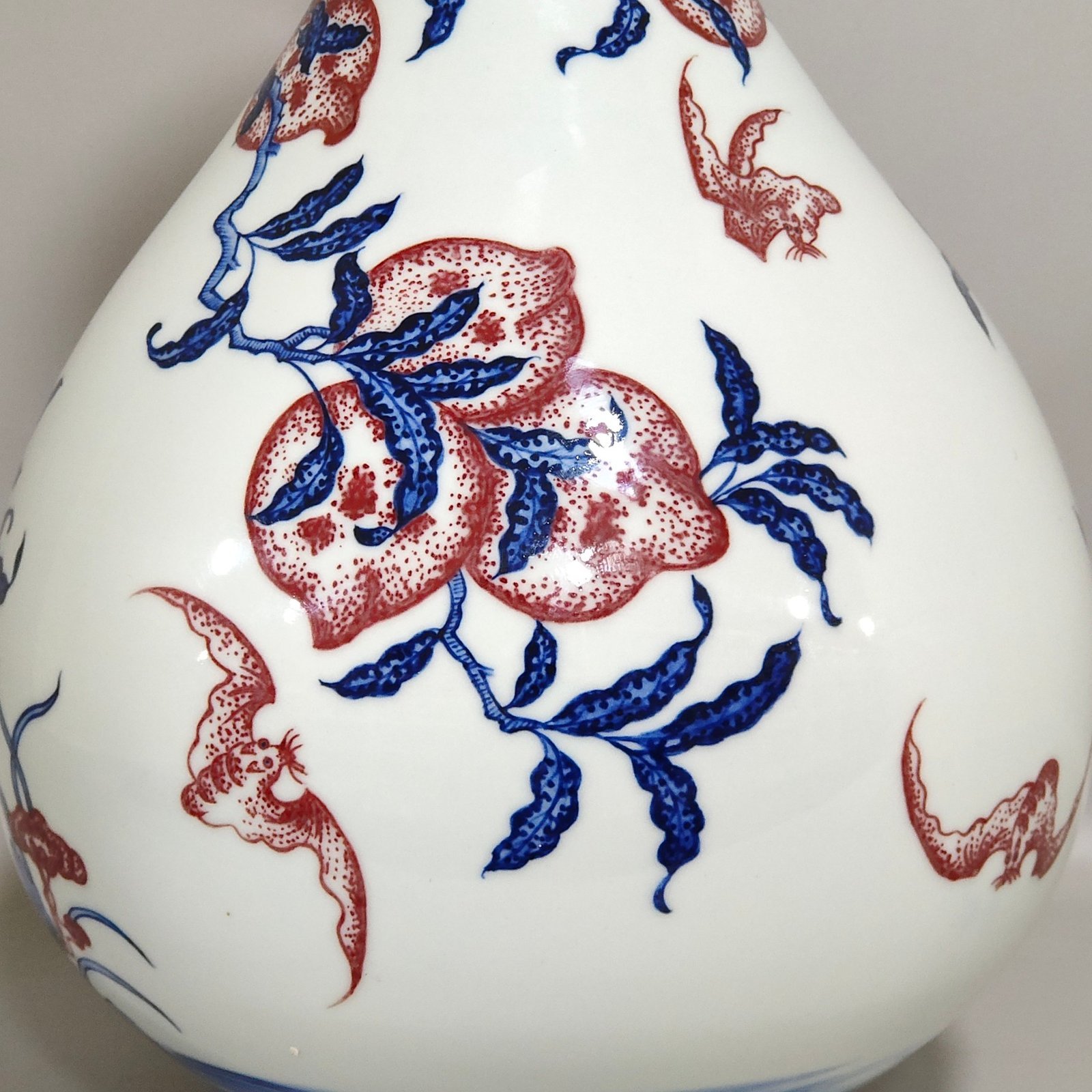 Qing Dynasty Qianlong blue and white underglaze red Nine Peach spring vase