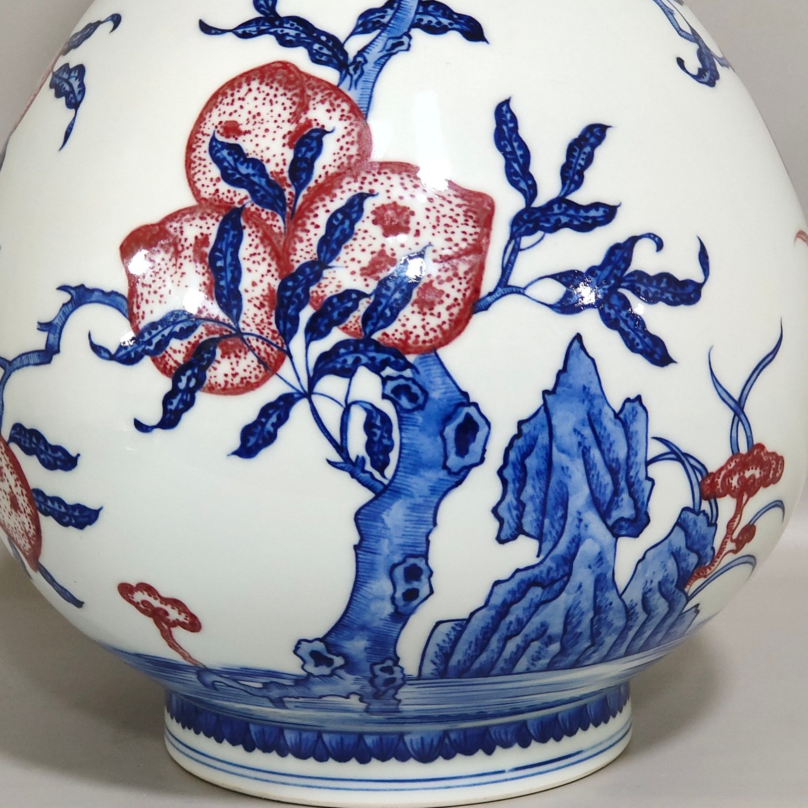 Qing Dynasty Qianlong blue and white underglaze red Nine Peach spring vase