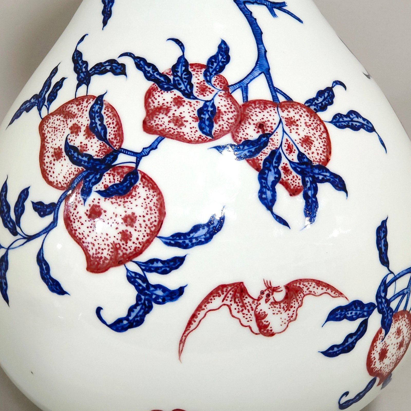 Qing Dynasty Qianlong blue and white underglaze red Nine Peach spring vase